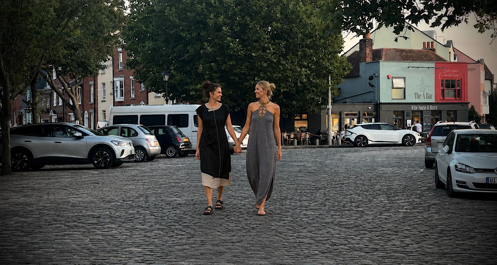 Two friends walking together wearing Galigak linen dresses